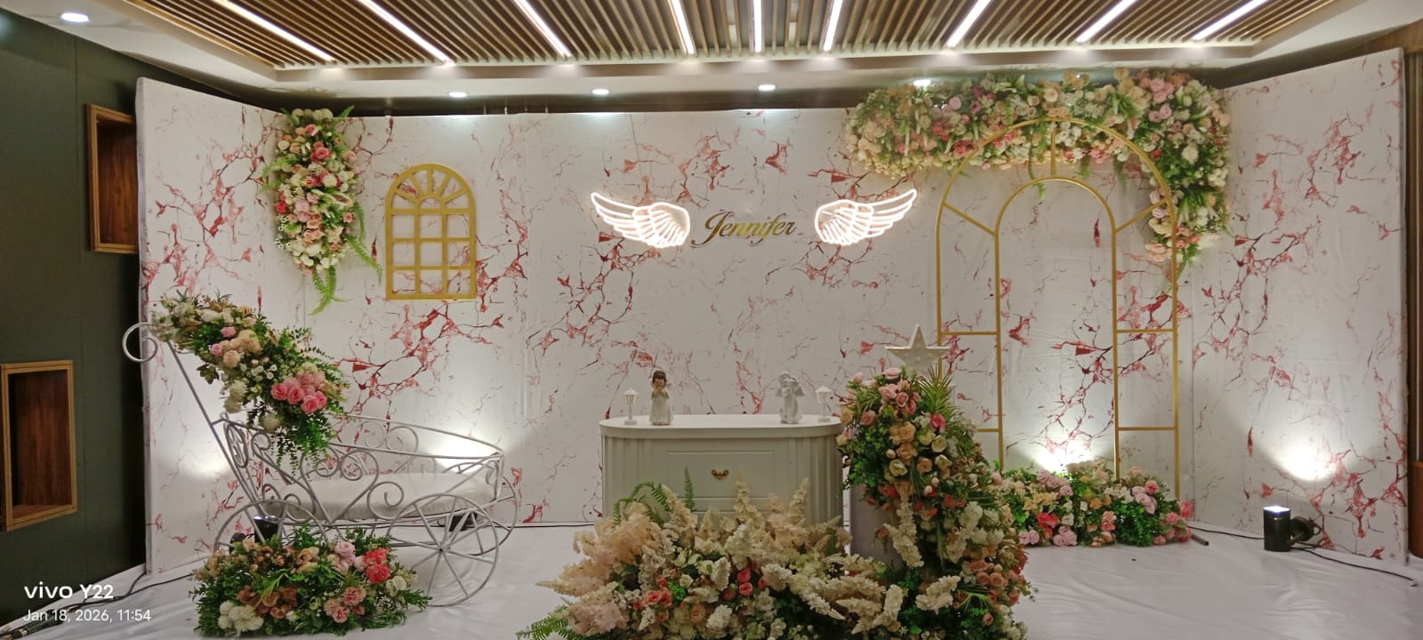 Floral engagement backdrop with illuminated name signage